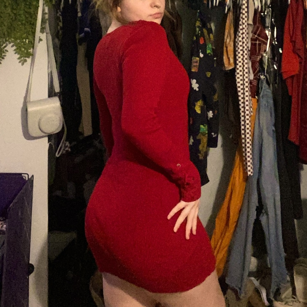 red ribbed dress with lace up forearms